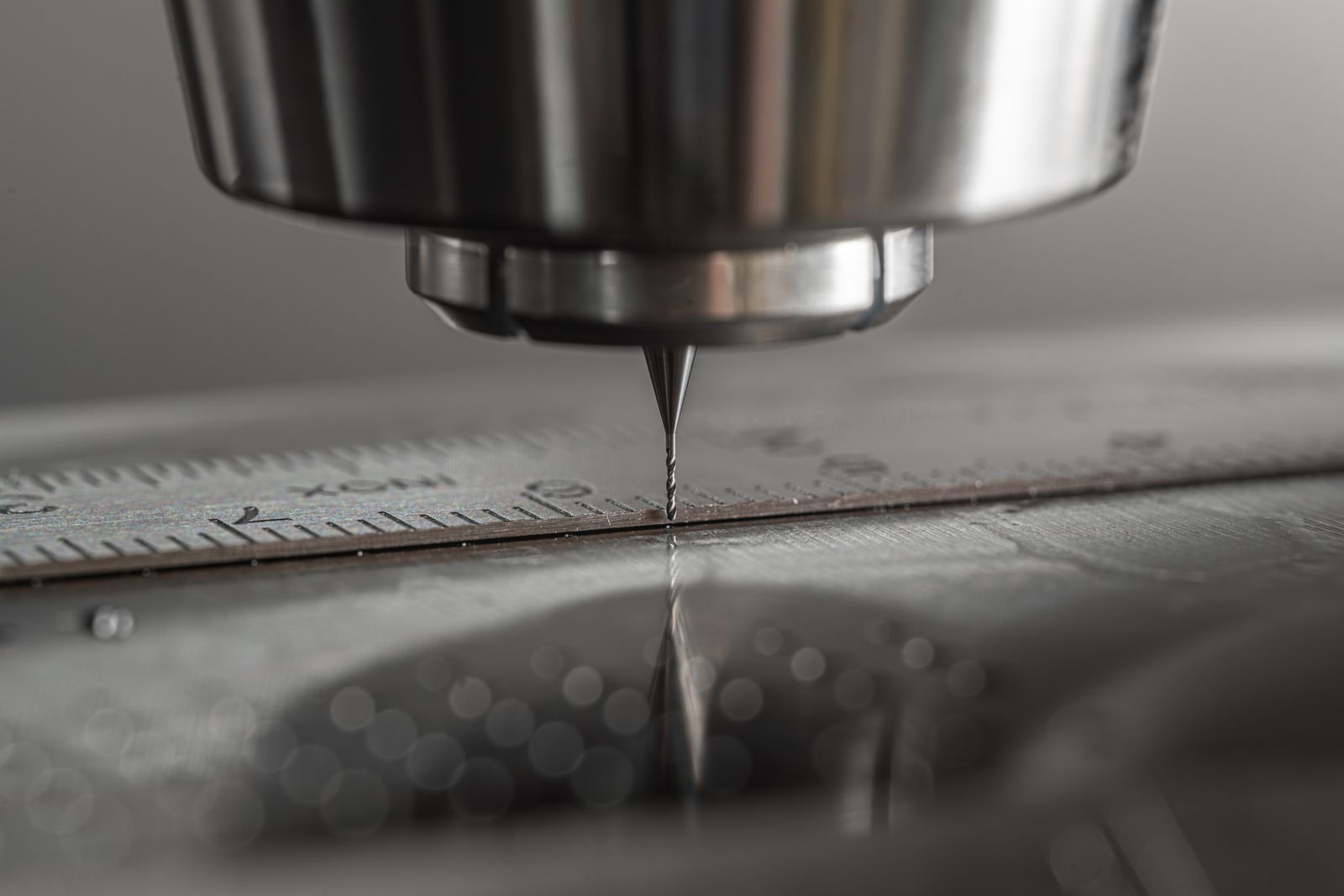 CNC milling machine cutting a metal component