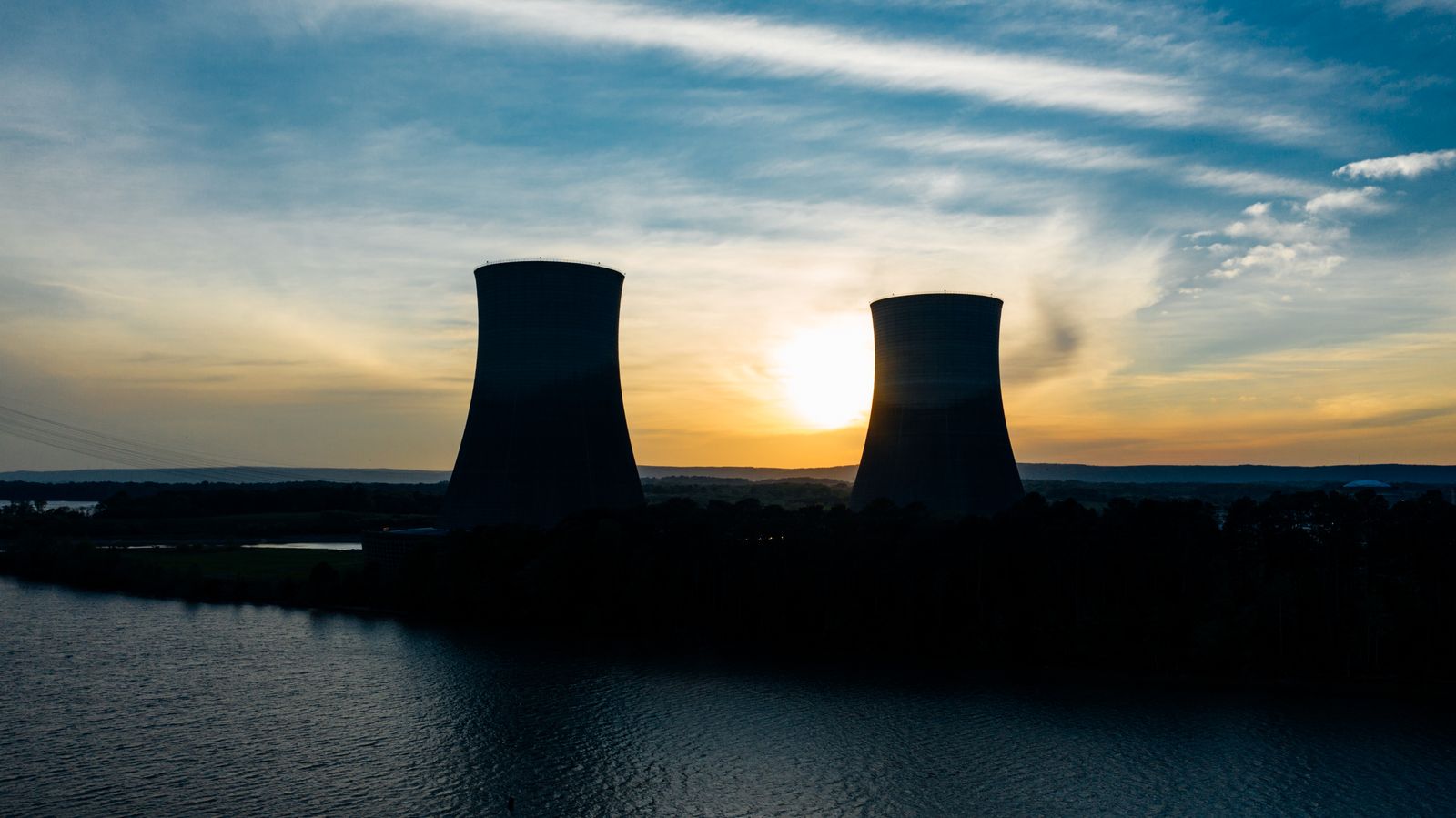 Power station cooling towers at sunset